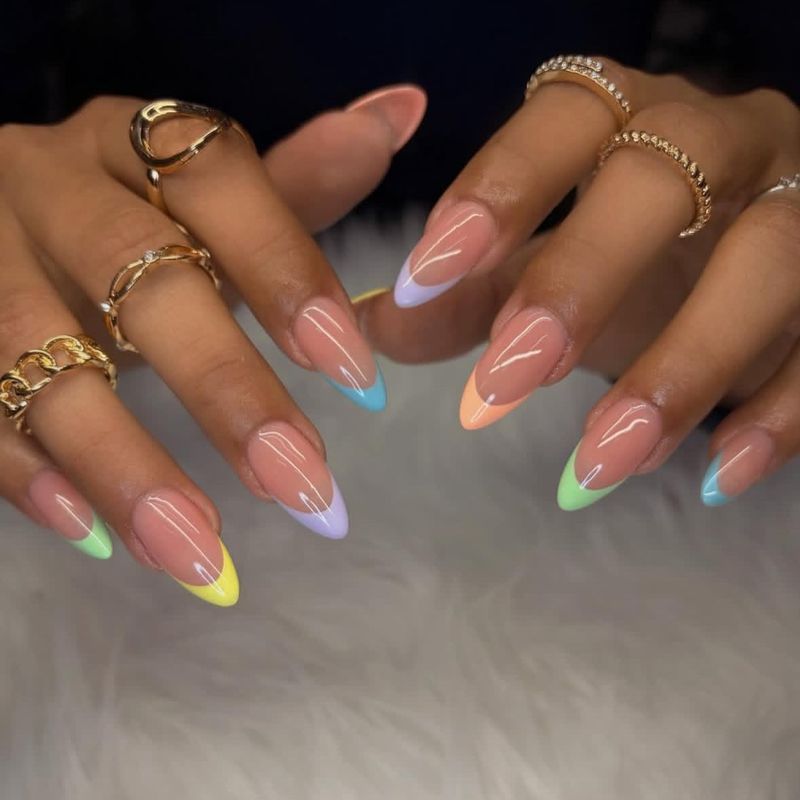 Rainbow French tip almond nails by Nini Nail Bar
