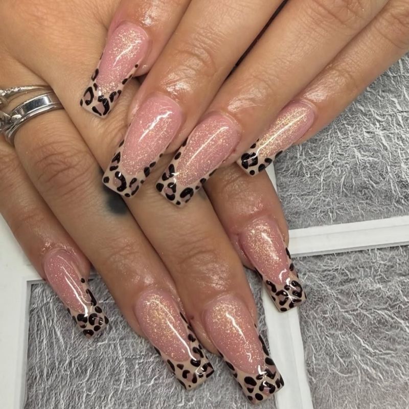 Leopard print French tip nails by Nini Nail Bar
