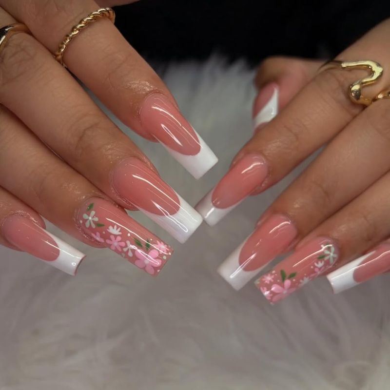 White French tip coffin nails with floral accent by Nini Nail Bar