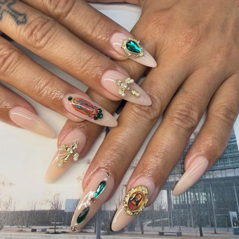 Nude almond nails with gem and gold accents by Nini Nail Bar